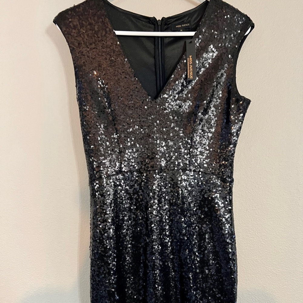 Perfect party dress! This brand new black sequin mini dress is stunning!